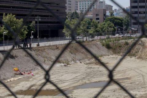Sunbathers in an empty pit in Downtown Los Angeles by Calder Greenwood. Photo by Calder Greenwood via KCET Departures.