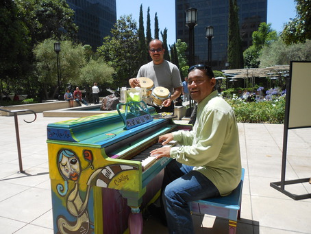 Musicians having fun at a street piano in Los Angeles. Photo by Elson Trinidad via streetpianos.com